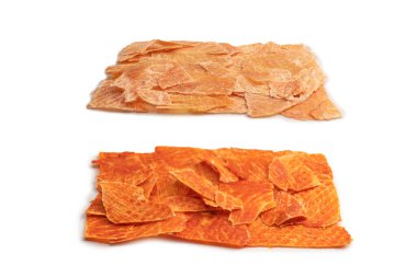 A group of tasty beer snacks. Dehydrated chicken meat slices. 