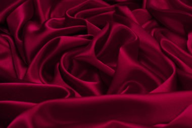 Zengin ve lüks kırmızı ipek kumaş dokusu. Üst görünüm.