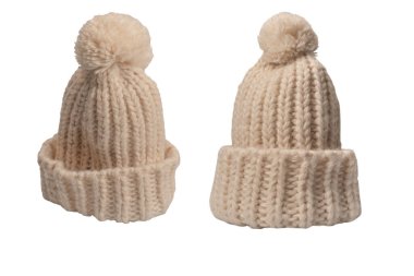 Beige warm beanie hat with pom pom isolated on a white background. 