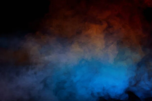 stock image Orange and red steam on a black background. Copy space.