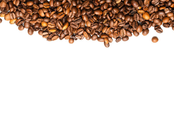 Coffee beans on a white background. Top view. Coffee beans texture.