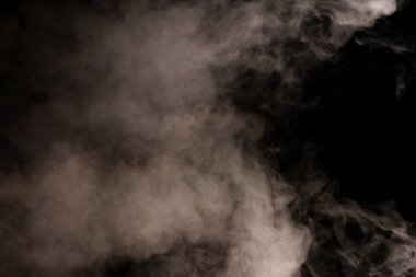 White steam on a black background. Copy space. clipart