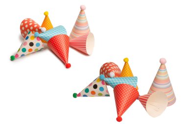 A group of bright and colorful birthday caps isolated on a white background. Holidays cocept. 