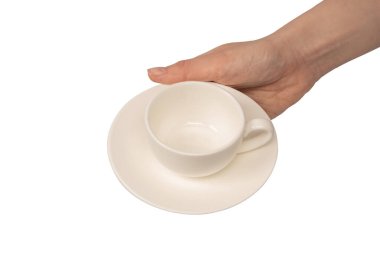 Beyaz arka planda izole edilmiş kahve fincanı ve çay tabağı tutan kadın.. 