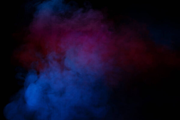 Purple and blue steam on a black background. Copy space.
