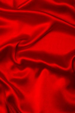 Kırmızı ipek ya da saten lüks kumaş dokusu soyut bir arka plan olarak kullanılabilir. Üst görünüm.