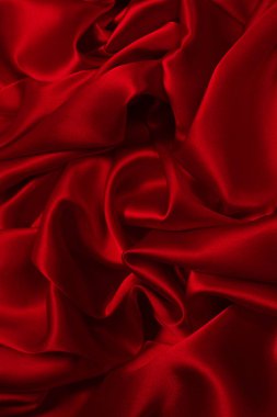 Zengin ve lüks kırmızı ipek kumaş dokusu. Üst görünüm.