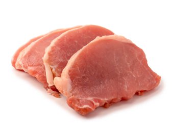 Beyaz arka planda çiğ domuz parçaları. Üst görünüm. 