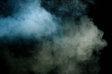 Siyah arka planda mavi ve sarı buhar. Boşluğu kopyala.