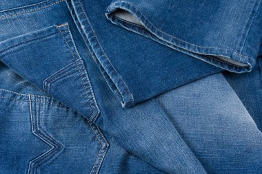 Arka plan olarak kot pantolon kumaşı. Üst görünüm. 