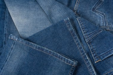 Arka plan olarak kot pantolon kumaşı. Üst görünüm. 