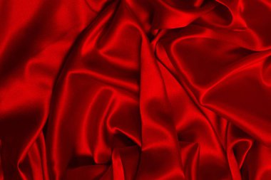 Zengin ve lüks kırmızı ipek kumaş dokusu. Üst görünüm.