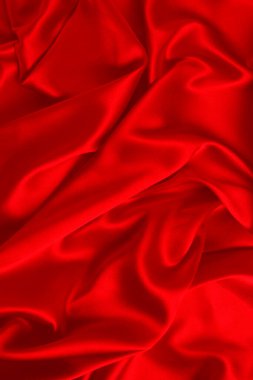 Kırmızı ipek ya da saten lüks kumaş dokusu soyut bir arka plan olarak kullanılabilir. Üst görünüm.