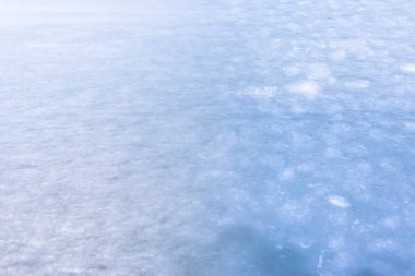 Buzun doğal dokusu, arka plan olarak donmuş göl..