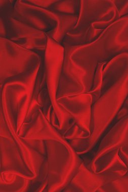 Zengin ve lüks kırmızı ipek kumaş dokusu. Üst görünüm.