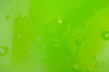 Arka plan olarak yeşil balçık oyuncağı. Üst görünüm. 