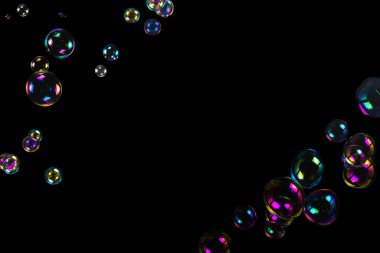 Soap bubbles isolated on a black background. Copy space.  clipart