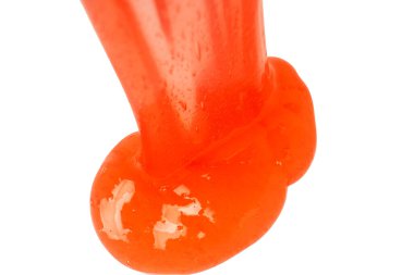 Beyaz arka planda izole edilmiş kırmızı balçık oyuncağı. Üst görünüm. 