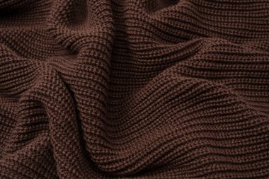 Arka plan olarak kahverengi süveter dokusu. Üst görünüm. 