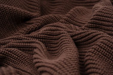 Arka plan olarak kahverengi süveter dokusu. Üst görünüm. 