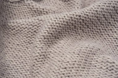 Arka plan olarak gri yün süveter dokusu. Üst görünüm.