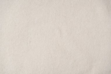 Arka plan olarak bej süveter dokusu. Üst görünüm. 