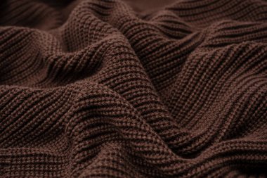 Arka plan olarak kahverengi süveter dokusu. Üst görünüm. 