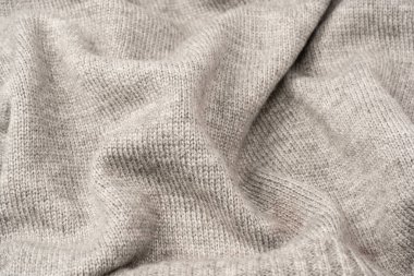 Arka plan olarak gri yün süveter dokusu. Üst görünüm.