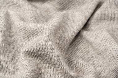 Arka plan olarak gri yün süveter dokusu. Üst görünüm.