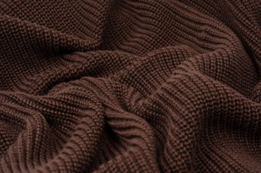 Arka plan olarak kahverengi süveter dokusu. Üst görünüm. 