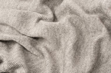 Arka plan olarak gri yün süveter dokusu. Üst görünüm.