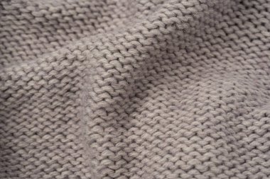 Arka plan olarak gri yün süveter dokusu. Üst görünüm.