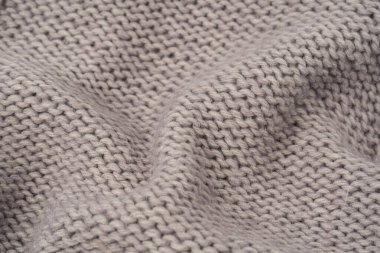 Arka plan olarak gri yün süveter dokusu. Üst görünüm.