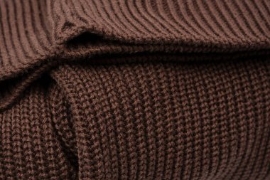 Arka plan olarak kahverengi süveter dokusu. Üst görünüm. 