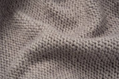 Arka plan olarak gri yün süveter dokusu. Üst görünüm.