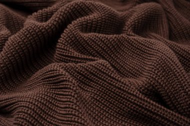 Arka plan olarak kahverengi süveter dokusu. Üst görünüm. 