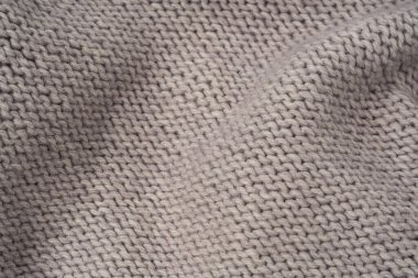 Arka plan olarak gri yün süveter dokusu. Üst görünüm.