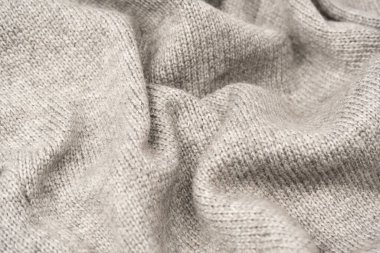 Arka plan olarak gri yün süveter dokusu. Üst görünüm.