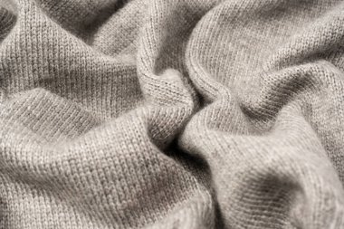 Arka plan olarak gri yün süveter dokusu. Üst görünüm.
