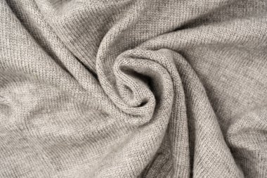 Arka plan olarak gri yün süveter dokusu. Üst görünüm.