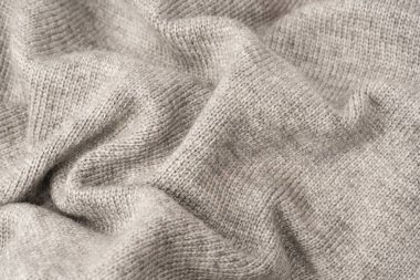 Arka plan olarak gri yün süveter dokusu. Üst görünüm.