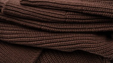 Arka plan olarak kahverengi süveter dokusu. Üst görünüm. 