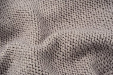Arka plan olarak gri yün süveter dokusu. Üst görünüm.