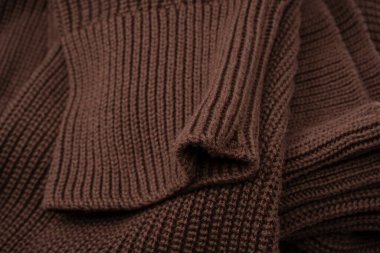 Arka plan olarak kahverengi süveter dokusu. Üst görünüm. 