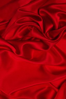 Zengin ve lüks kırmızı ipek kumaş dokusu. Üst görünüm.