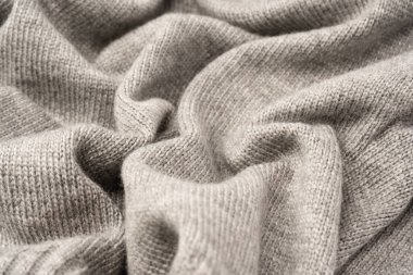 Arka plan olarak gri yün süveter dokusu. Üst görünüm.