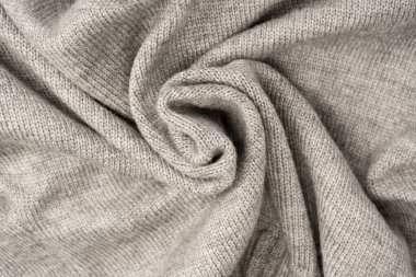 Arka plan olarak gri yün süveter dokusu. Üst görünüm.