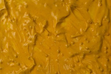 Sarı sos arka plan olarak sıçrıyor. Üst görünüm. 