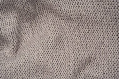 Arka plan olarak gri yün süveter dokusu. Üst görünüm.