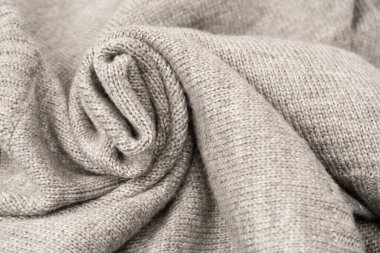 Arka plan olarak gri yün süveter dokusu. Üst görünüm.